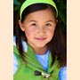 headshot of girl in headband